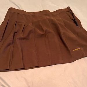 Brown skirt with orange letters